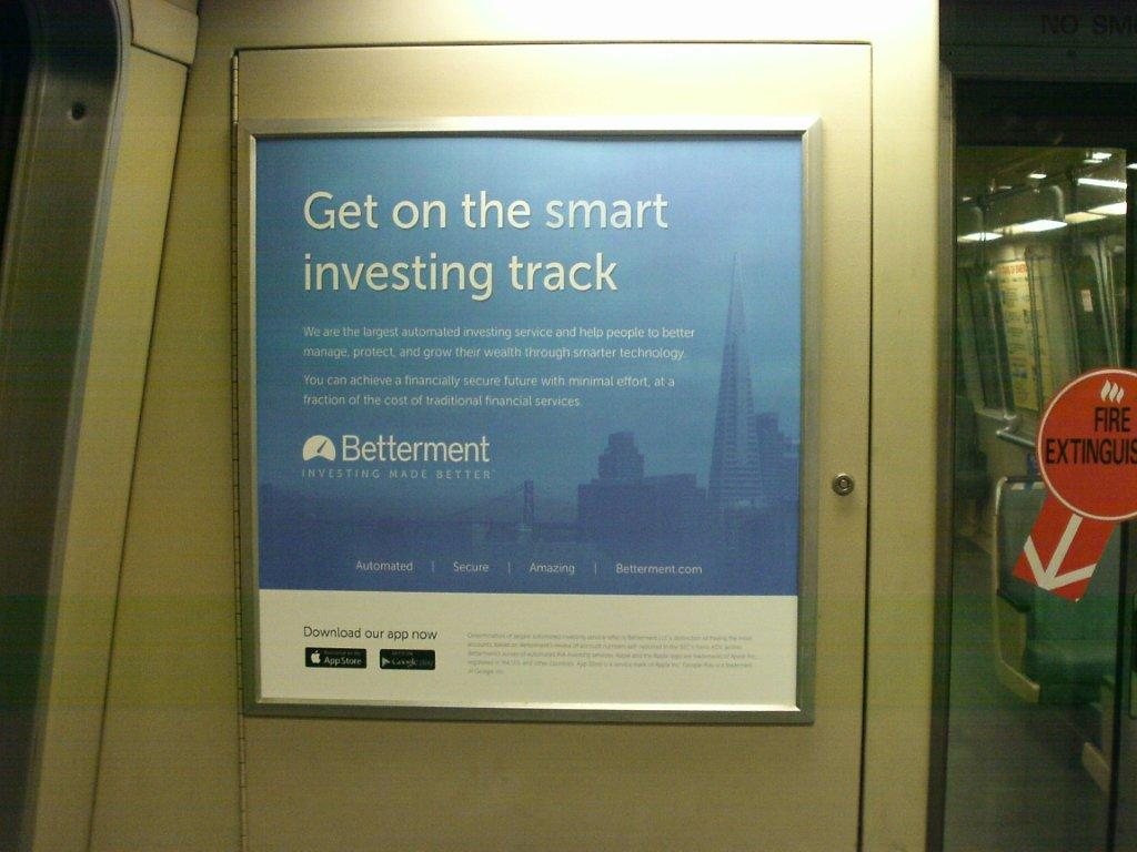 Betterment car card on a BART train: Get on the smart investing track