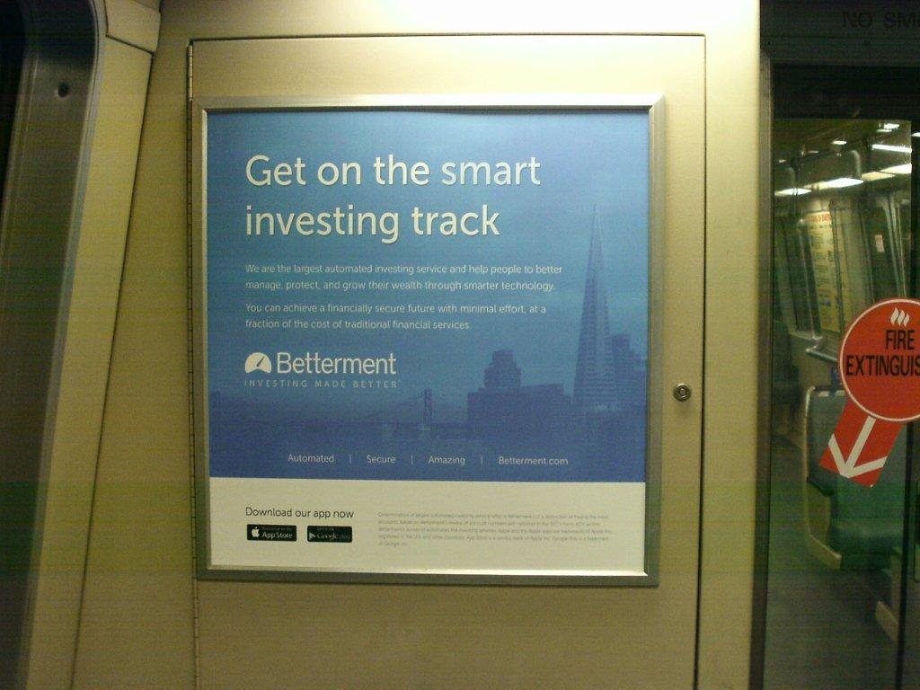 Betterment car card on a BART train: Get on the smart investing track